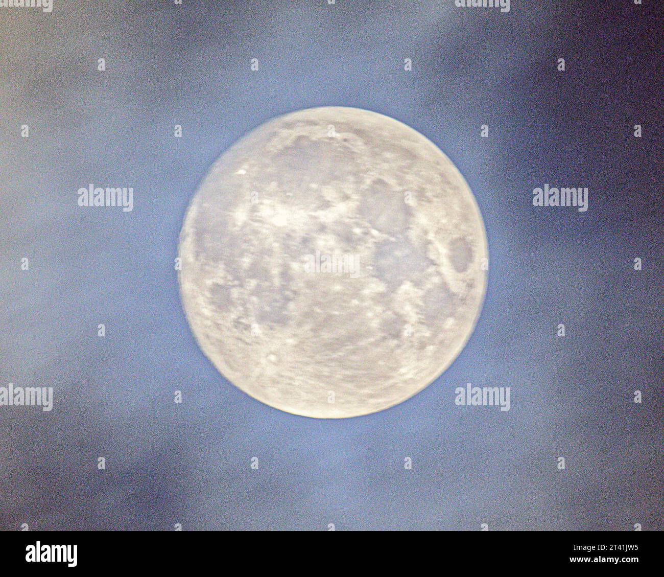 Glasgow, Scotland, UK. 28th October, 2023. UK Weather: Full hunters moon through the clouds  Credit Gerard Ferry/Alamy Live News Stock Photo
