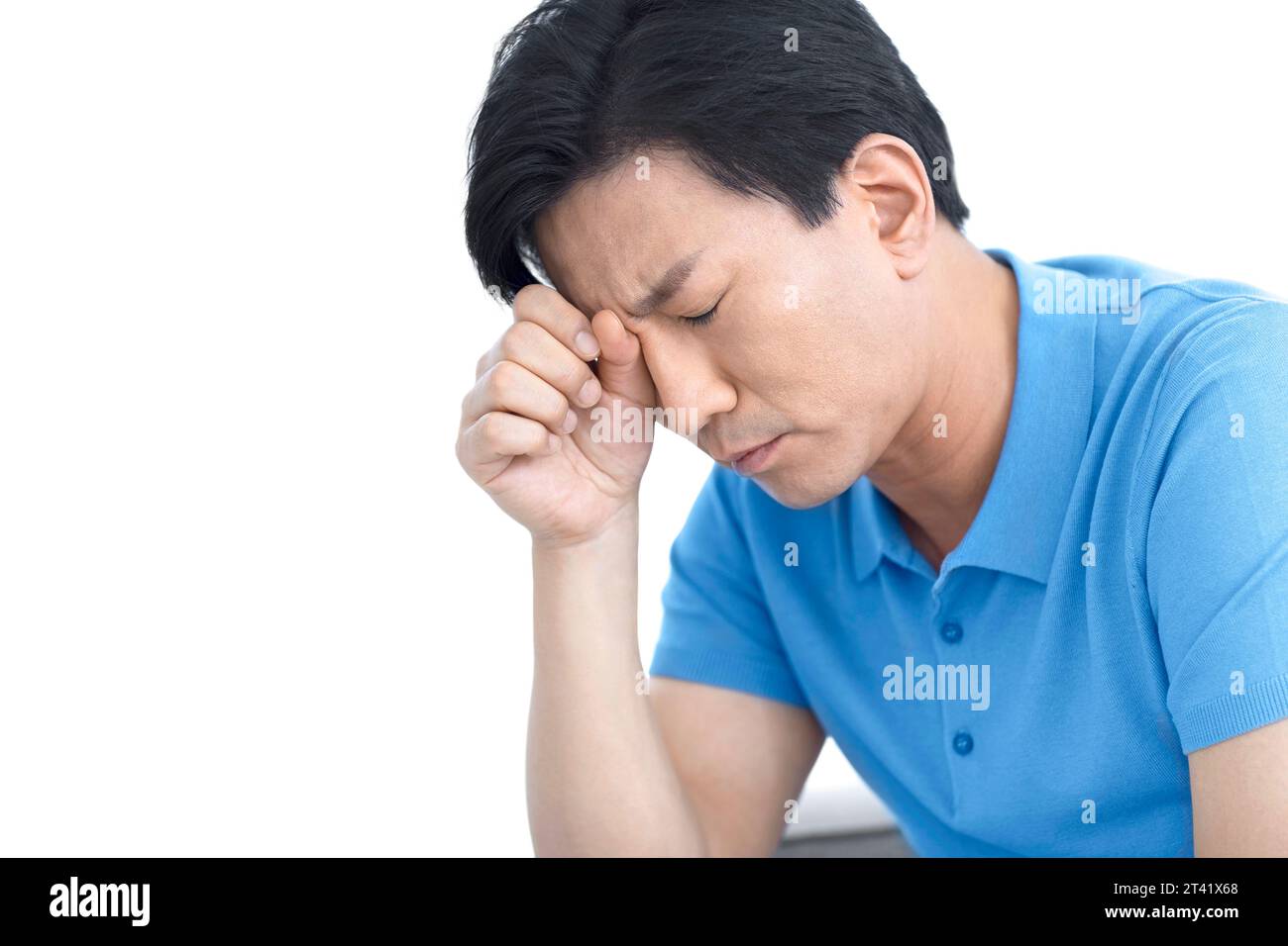 Man rubbing his eye Stock Photo