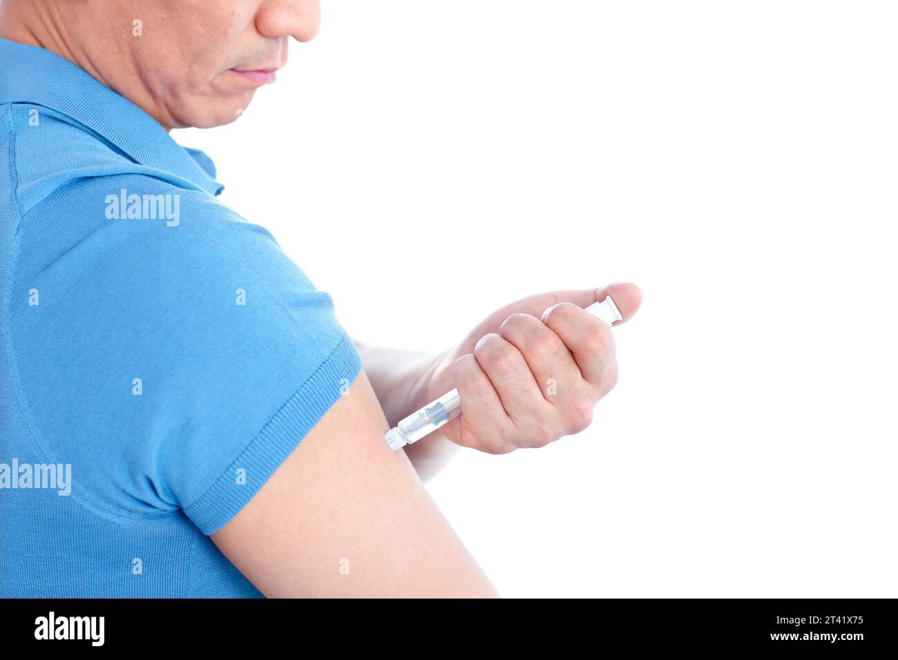 Man self-injecting Stock Photo