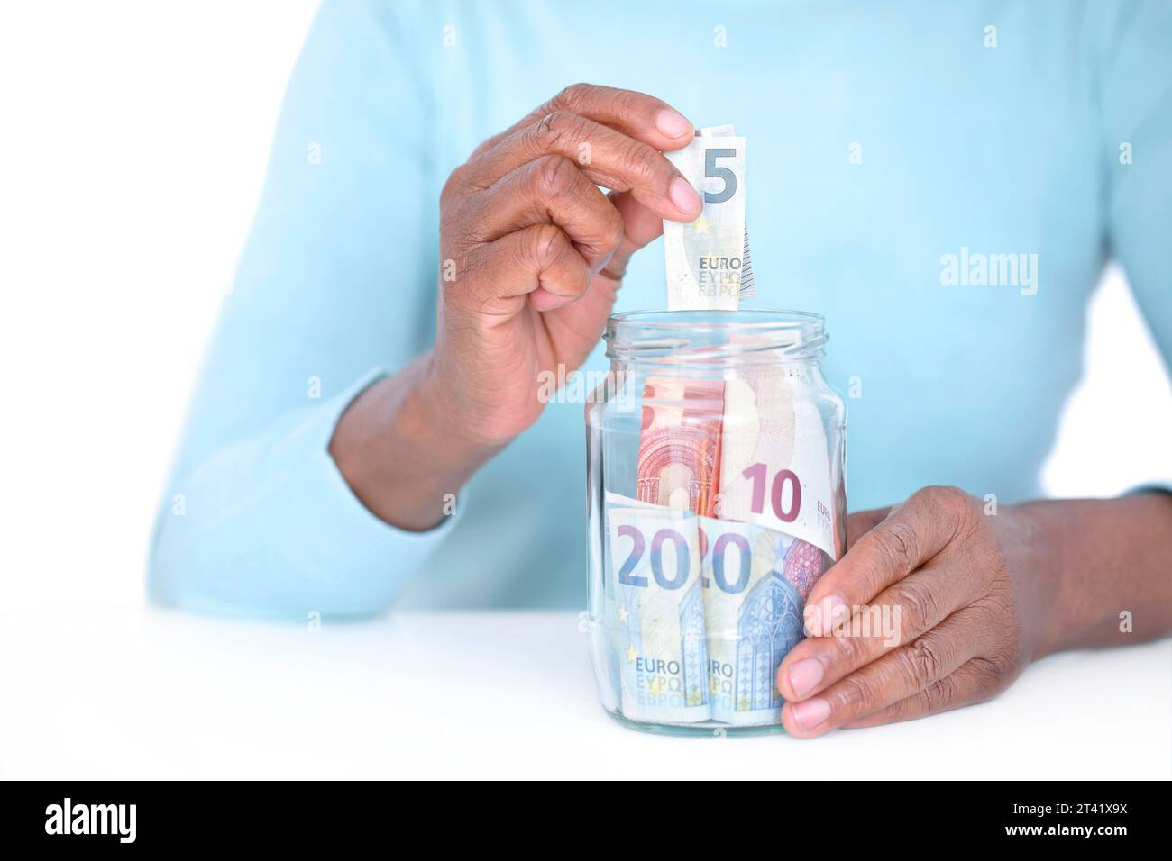 Woman saving money Stock Photo