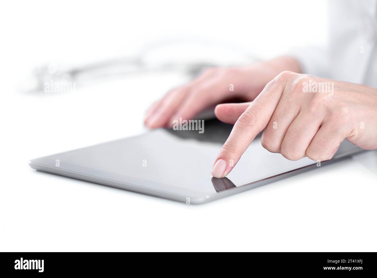 Doctor using digital tablet Stock Photo