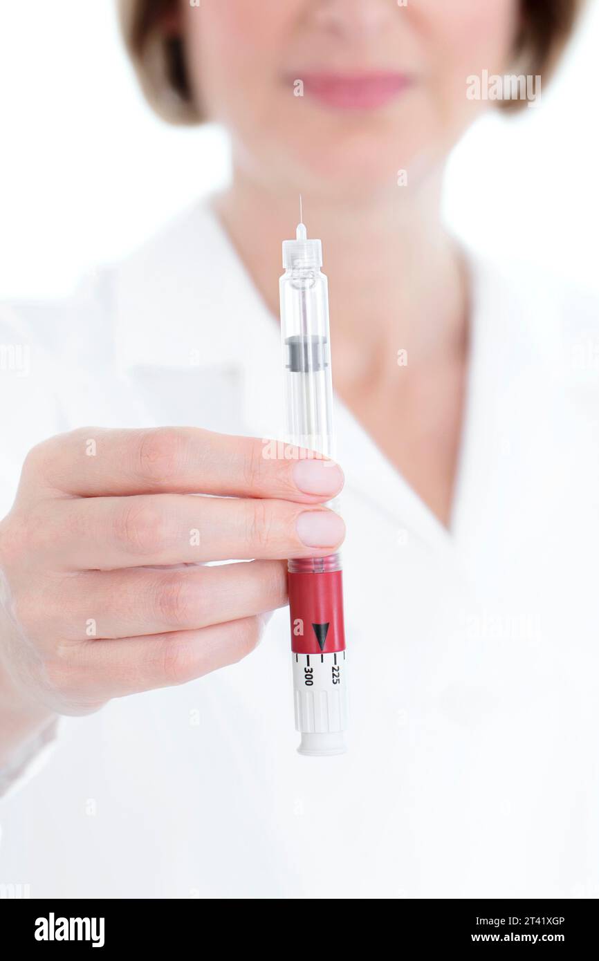 Doctor with autoinjector Stock Photo - Alamy