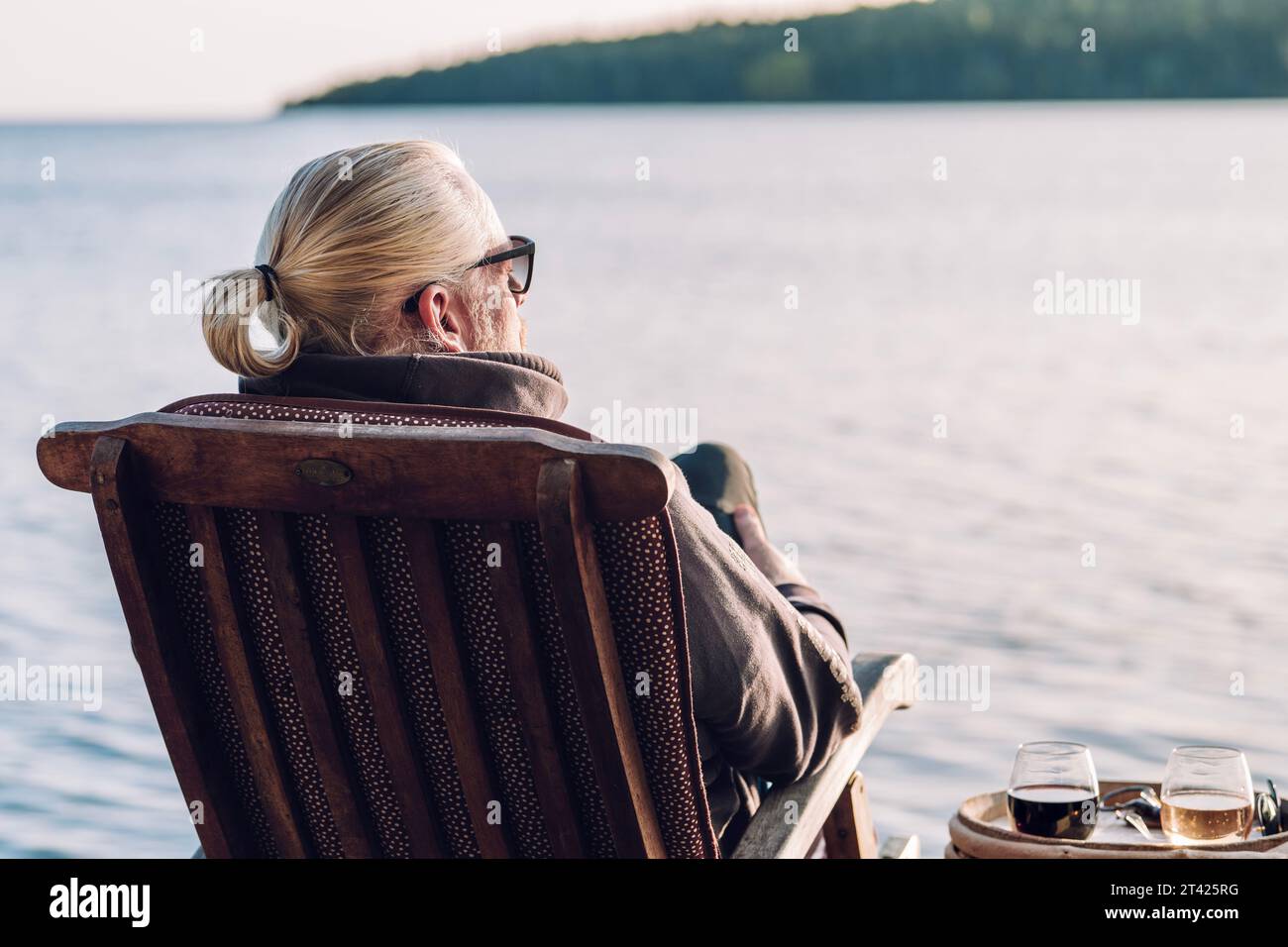 Old man sitting on chair hi-res stock photography and images - Alamy