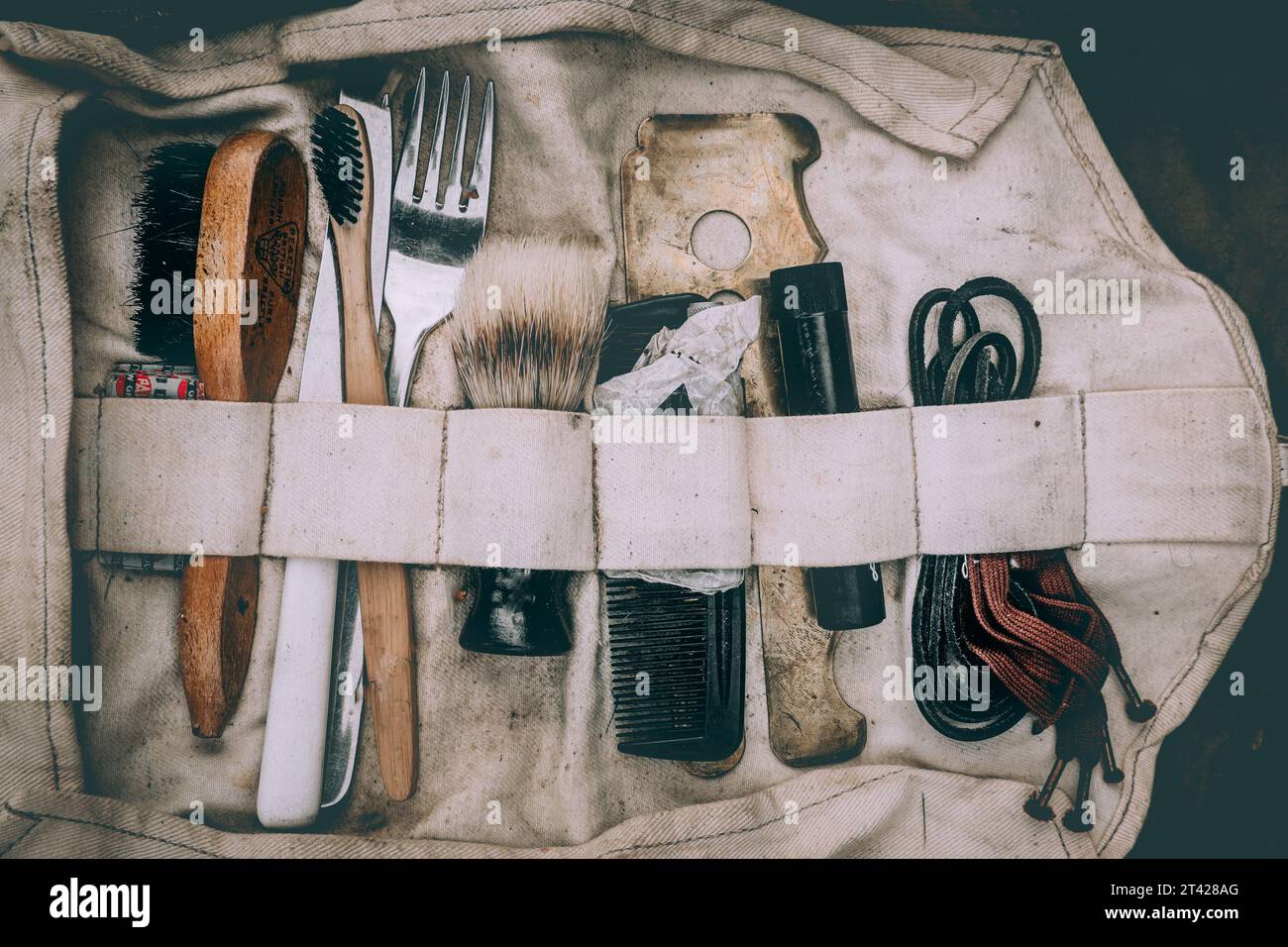 A close-up of a tool bag filled with various hair tools and utensils Stock Photo