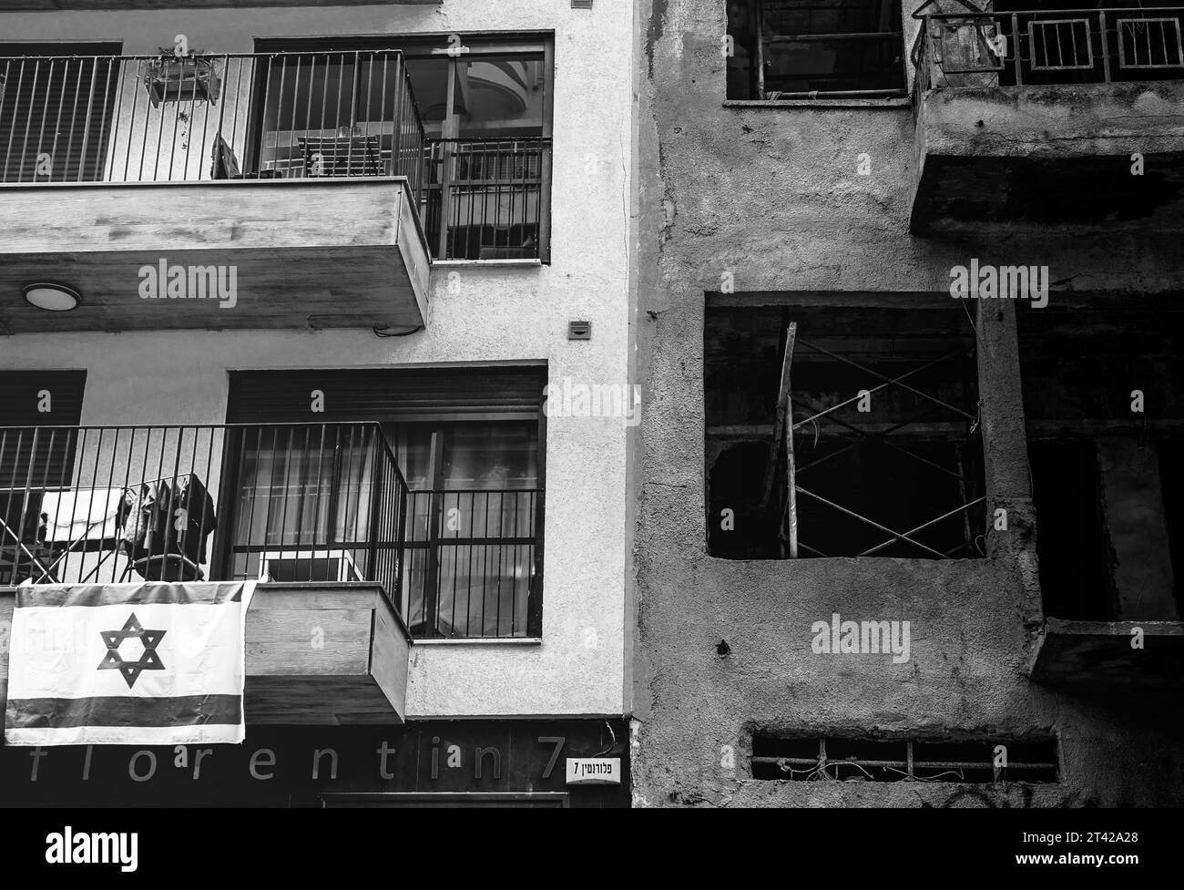 A diverse group of people standing on the balcony of their apartment ...
