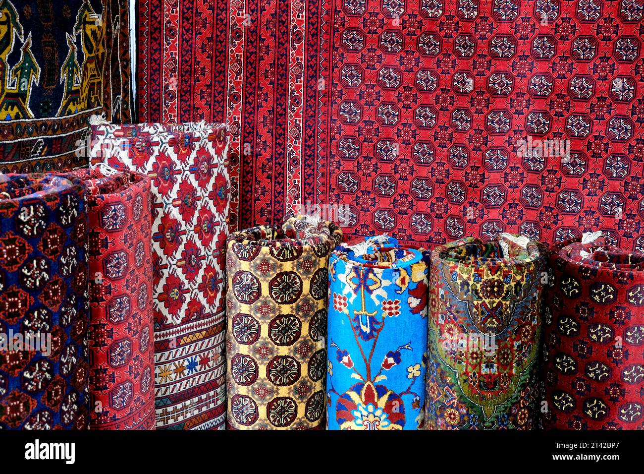 Carpet being rolled and displayed at a carpet exhibition in pune