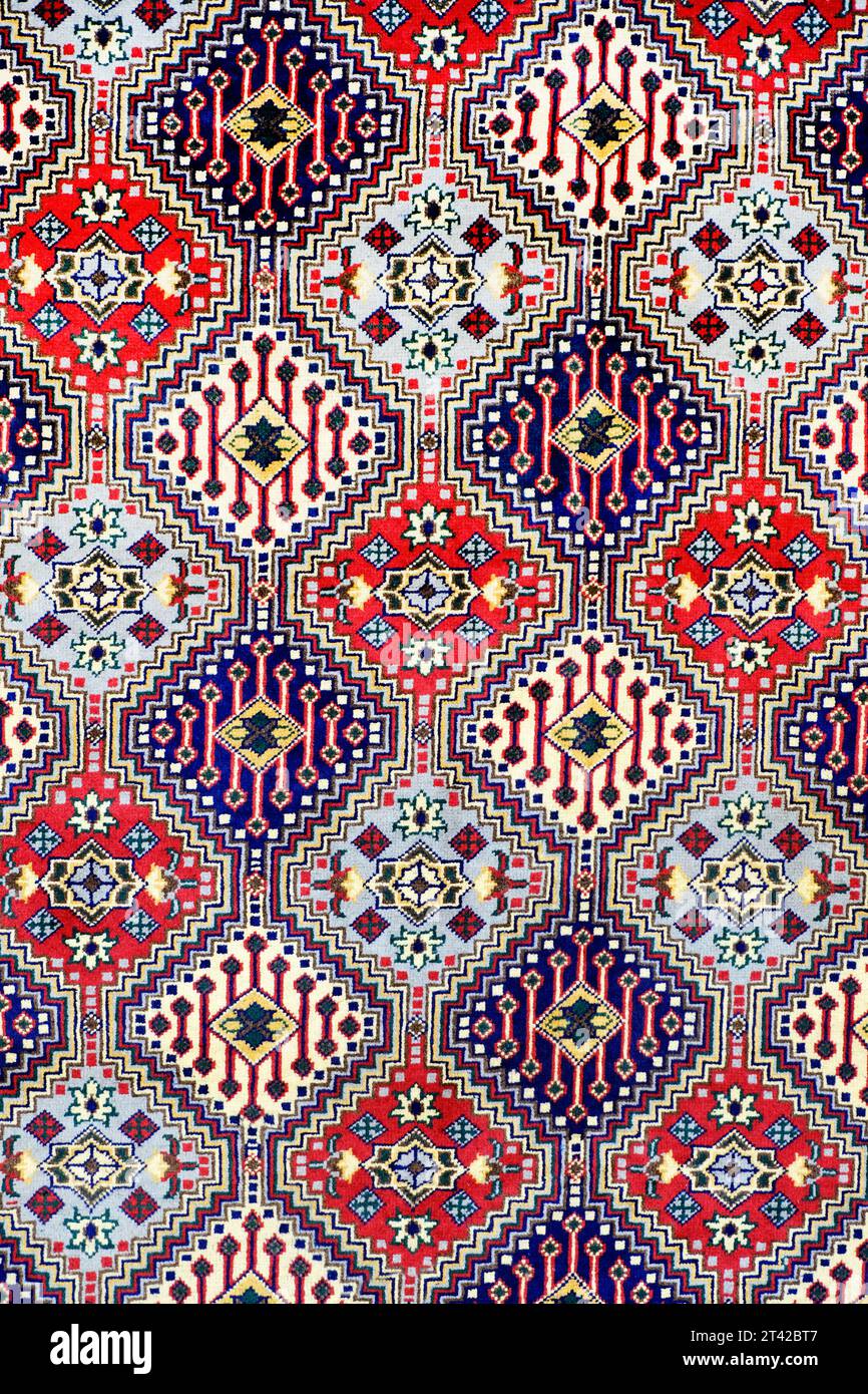 Carpet being rolled and displayed at a carpet exhibition in pune