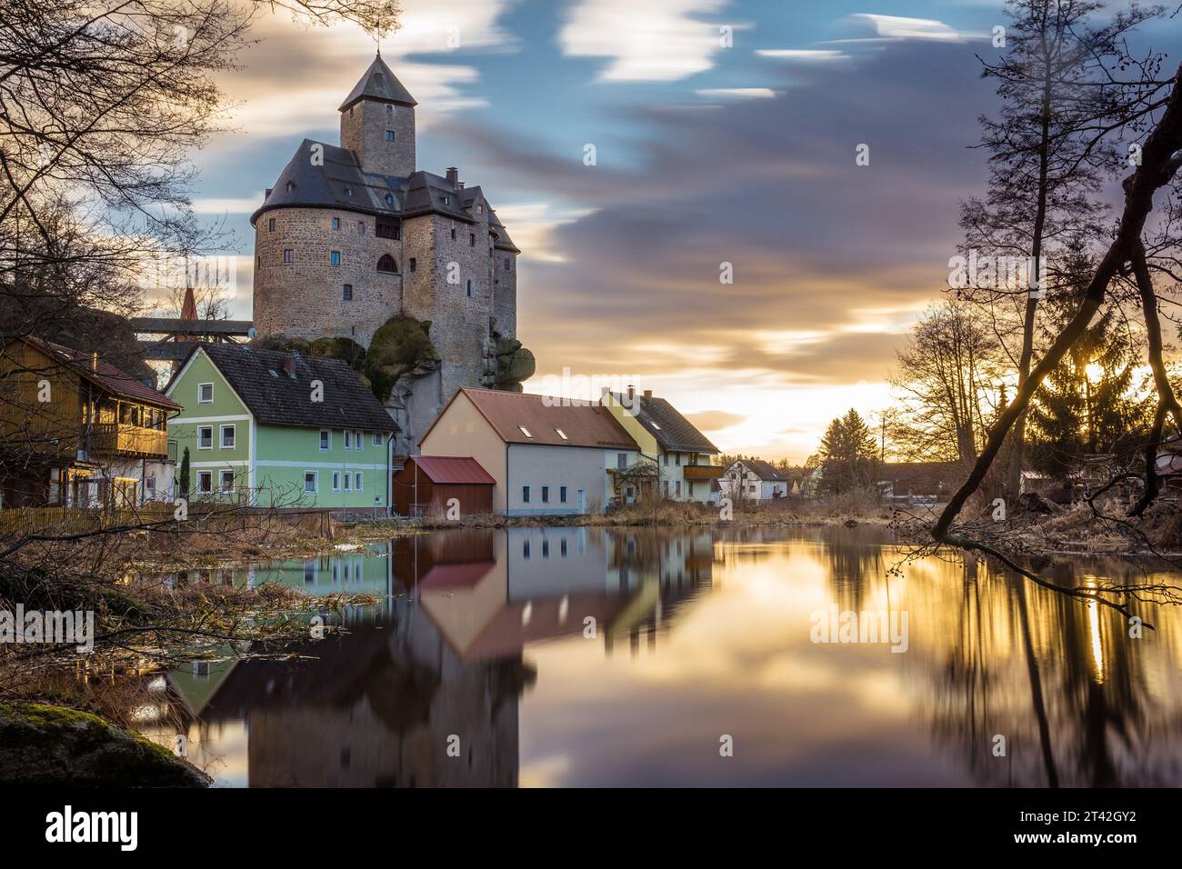 A stunning sunset over Falkenberg Fortress, a historic landmark located in Bavaria, Germany Stock Photo