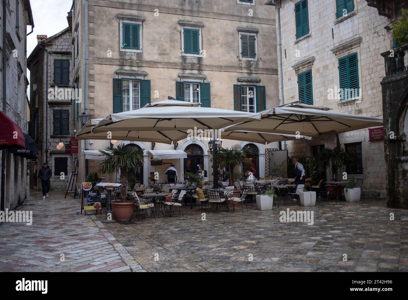 Montenegro, Apr 15, 2023: A restaurant terrace at the Flour Square in Kotor Old Town Stock Photo