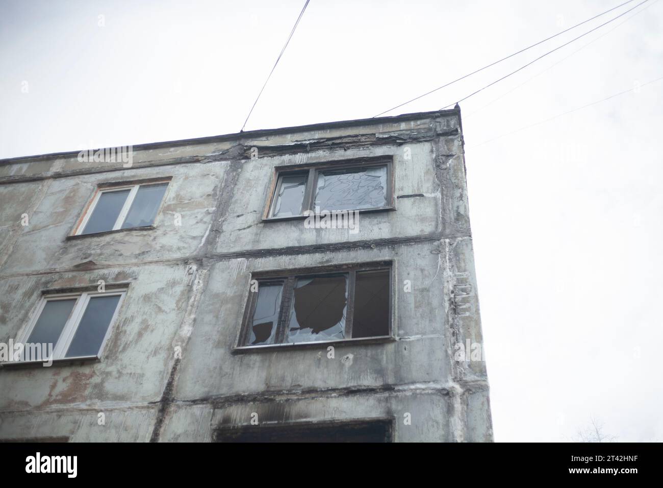 Burnt house. Apartment burned down in multistorey building. Fire in apartment. Broken window