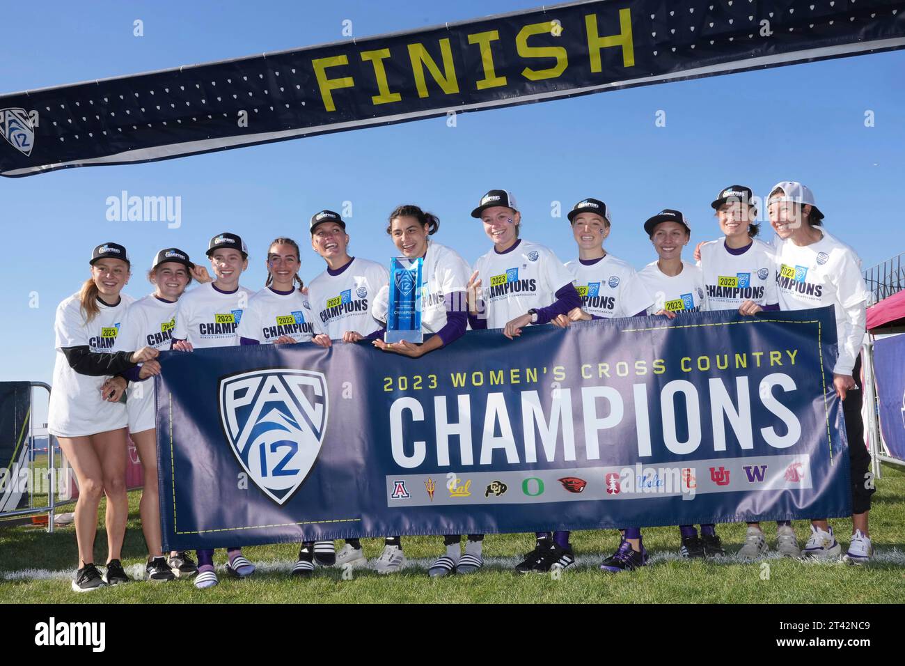 Members of the Washington Huskies women's team and coach Maurica Powell