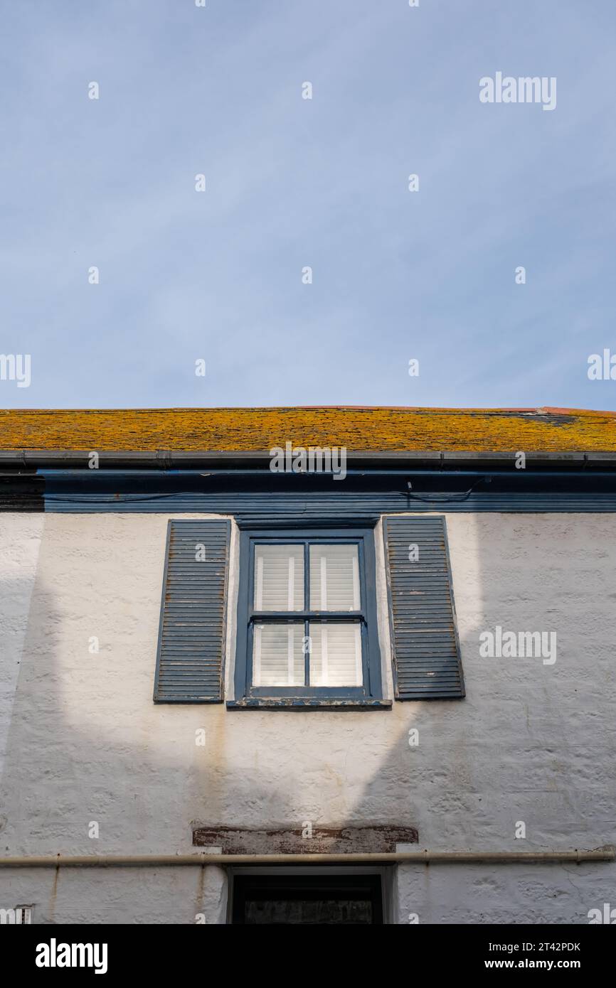 House with Decorative Shutters Stock Photo