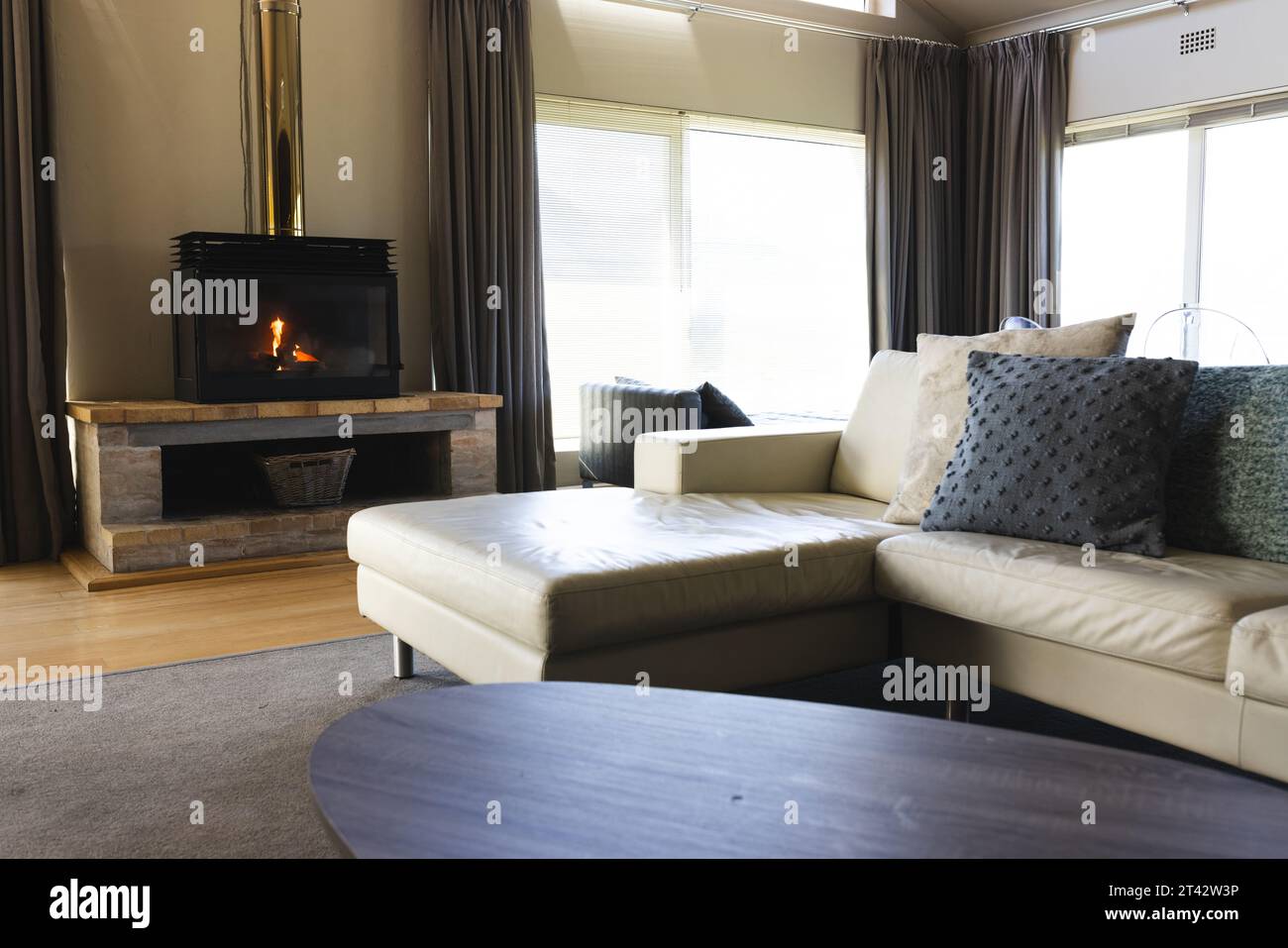 General view of living room with sofa and fireplace Stock Photo