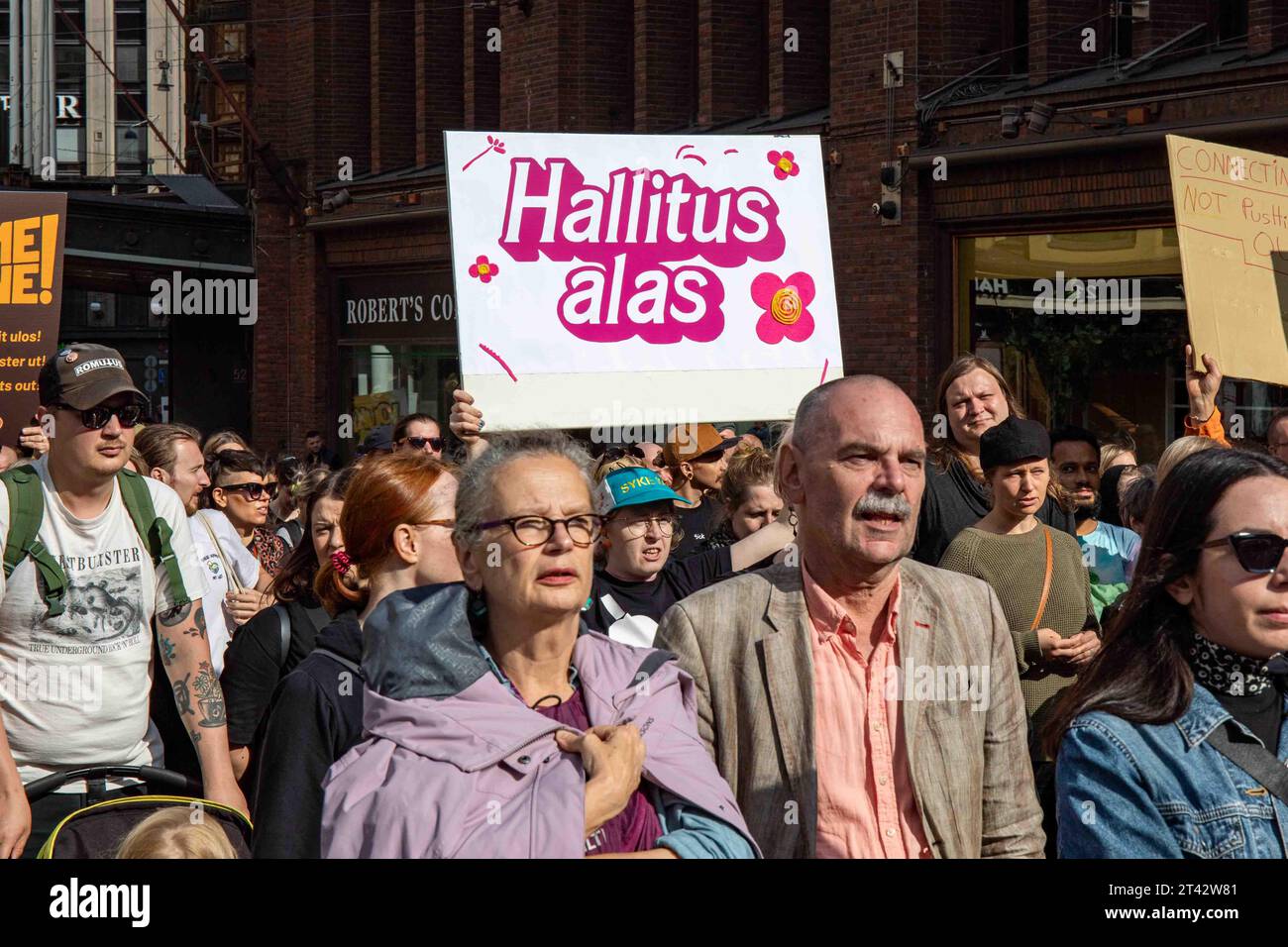 Hallitus alas. Protesters marching on Aleksanterinkatu at Me emme vaikene! anti-racism demonstration in Helsinki, Finland. Stock Photo