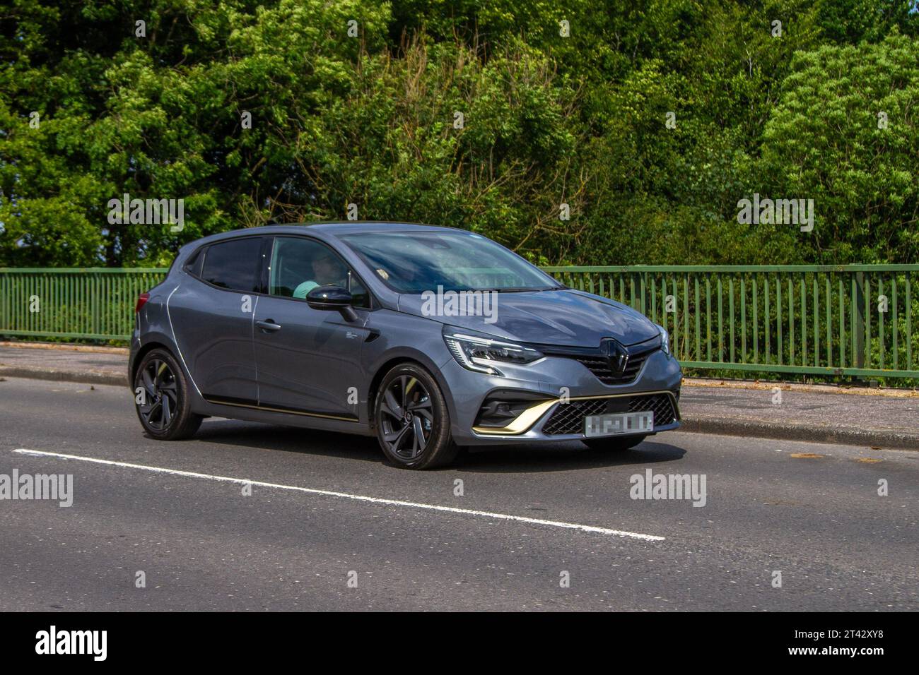 2023 Renault Clio E-Tech Engineered Hev A E-Tech 145 Auto HEV 1.2Kwh Start/Stop Grey Car Hatchback Hybrid Electric 1598 cc; travelling at speed on the M6 motorway in Greater Manchester, UK Stock Photo
