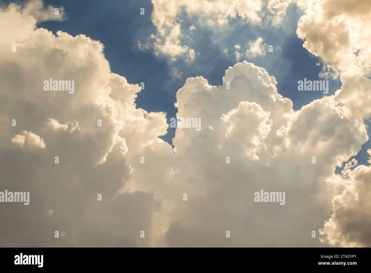 Blue summer sky with fluffy white clouds Stock Photo - Alamy