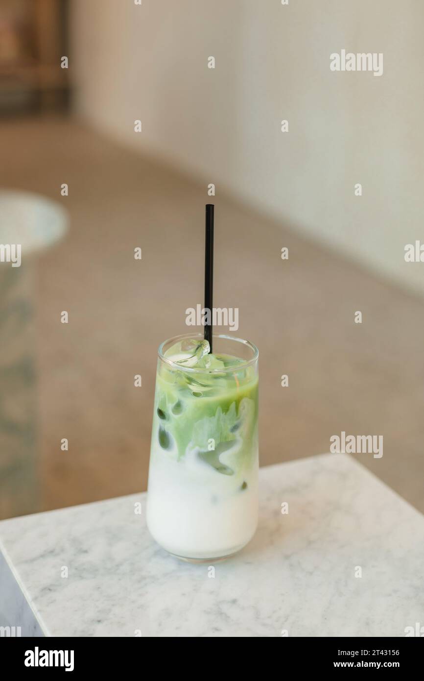 Close-up of a matcha latte on a marble table Stock Photo