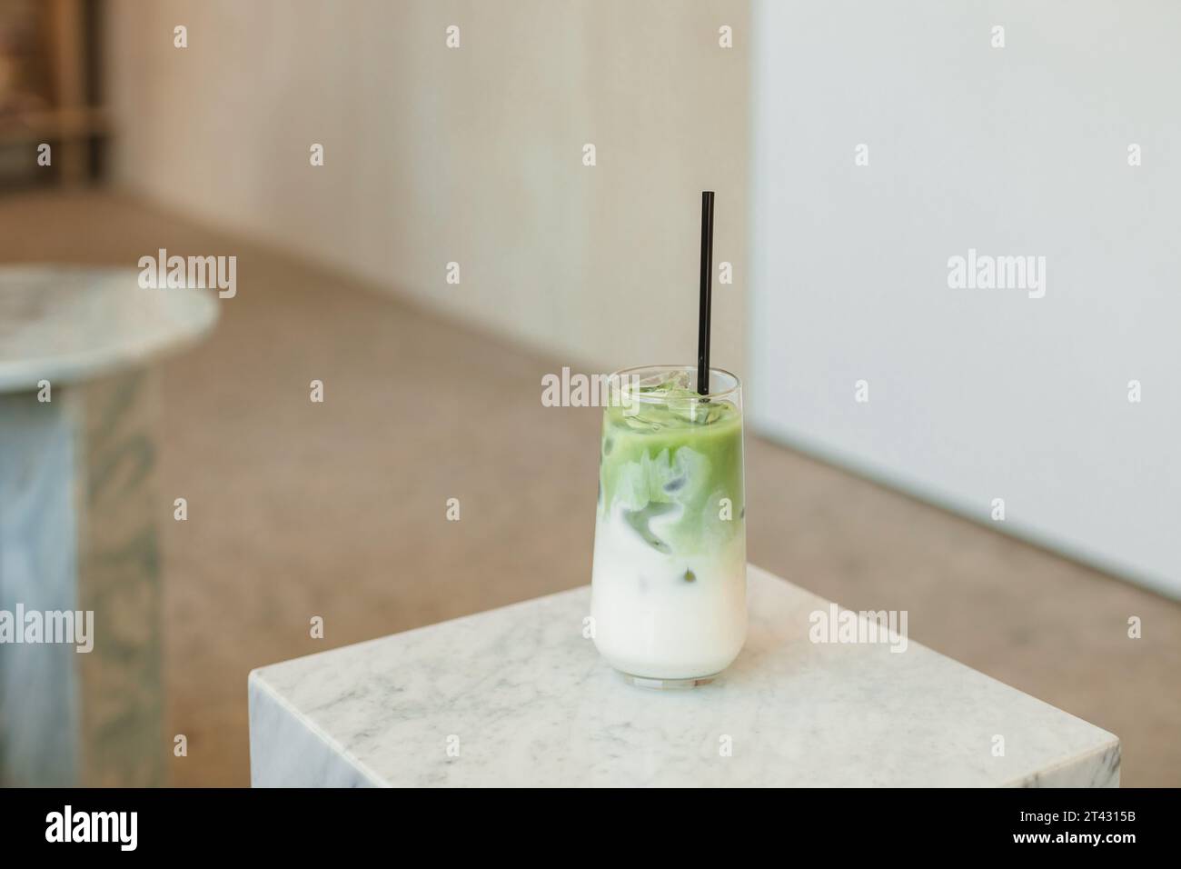 Close-up of a matcha latte on a marble table Stock Photo