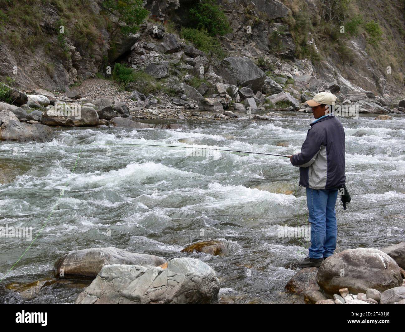 Man trout fishing in Himachal Pradesh, in the Indian Himalayas Stock