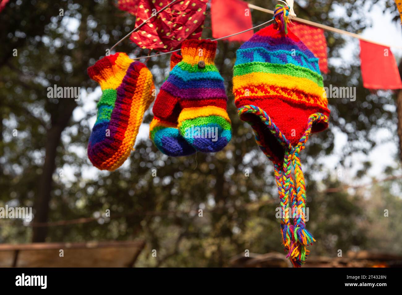 Assorted multi coloured knitwear for sale in a market, New Delhi, India Stock Photo