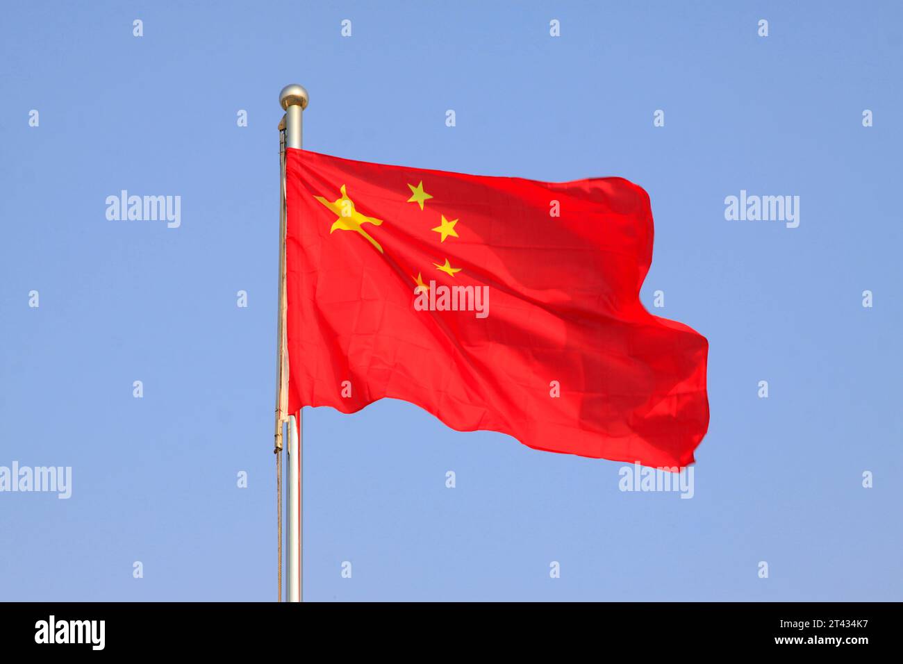 flag of the Republic of China, waving in the blue sky. Stock Photo