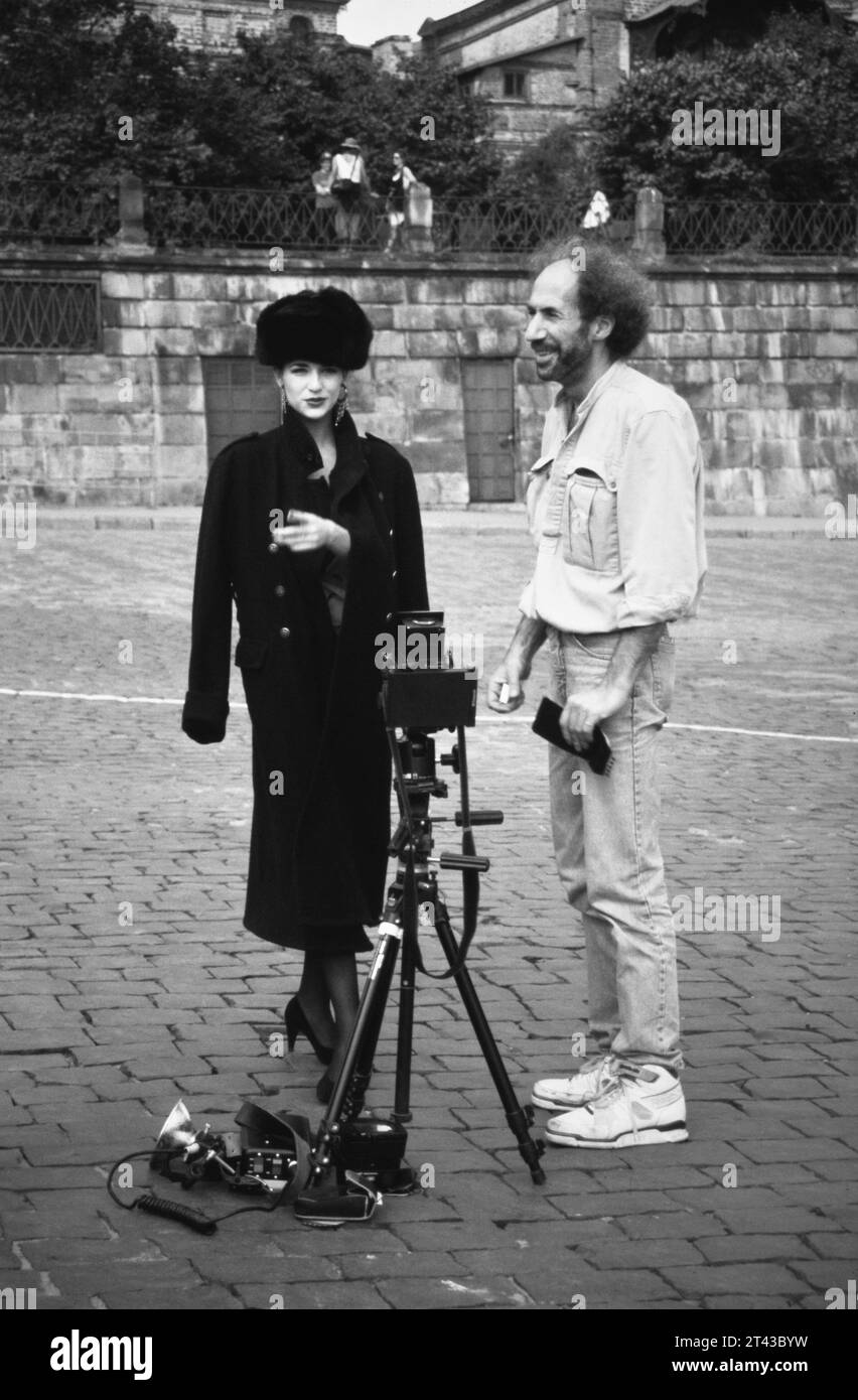 Archive Historical Image Of A Fashion Photographer And Model In A Russian Fur Round Hat And Coat Standing By A Large Format Polaroid Camera On A Tripod During A Fashion Shoot In Red Square, Moscow 1990 Stock Photo