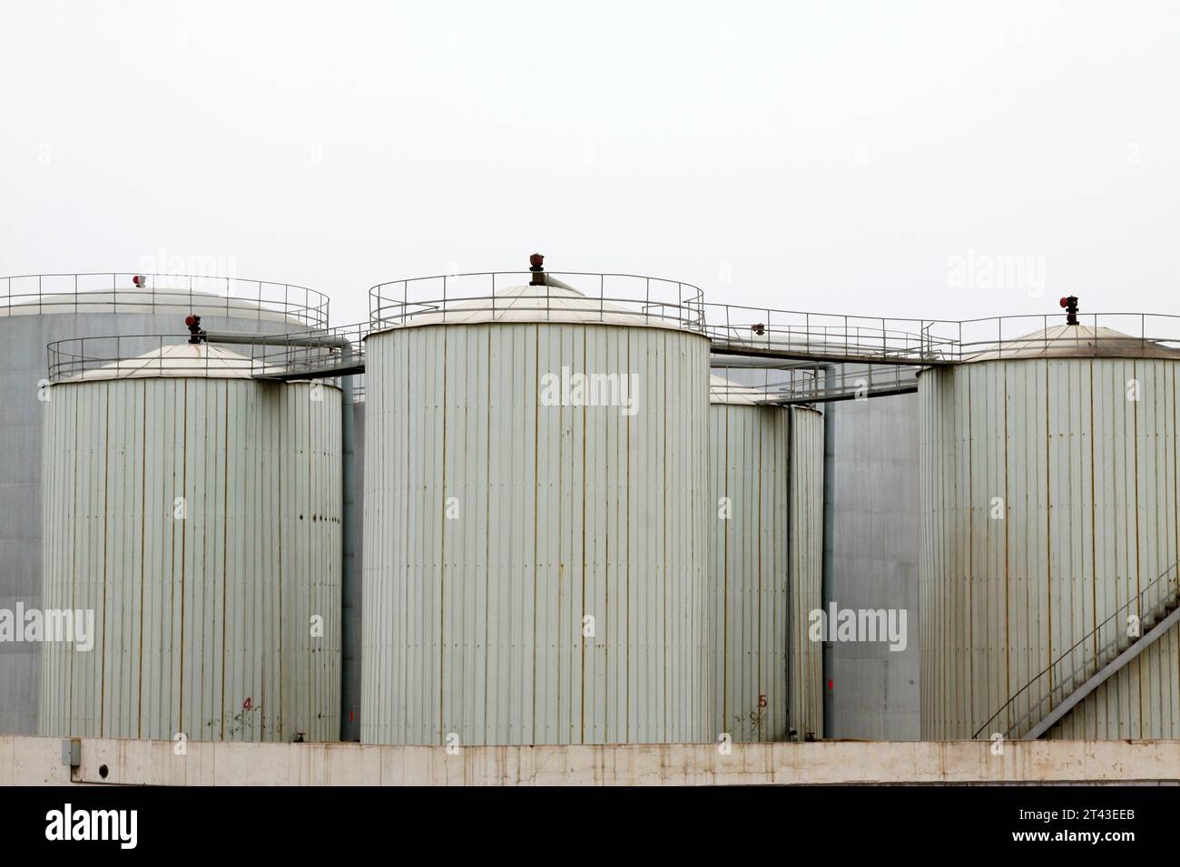 Storage tanks in a production enterprise, closeup of photo Stock Photo ...