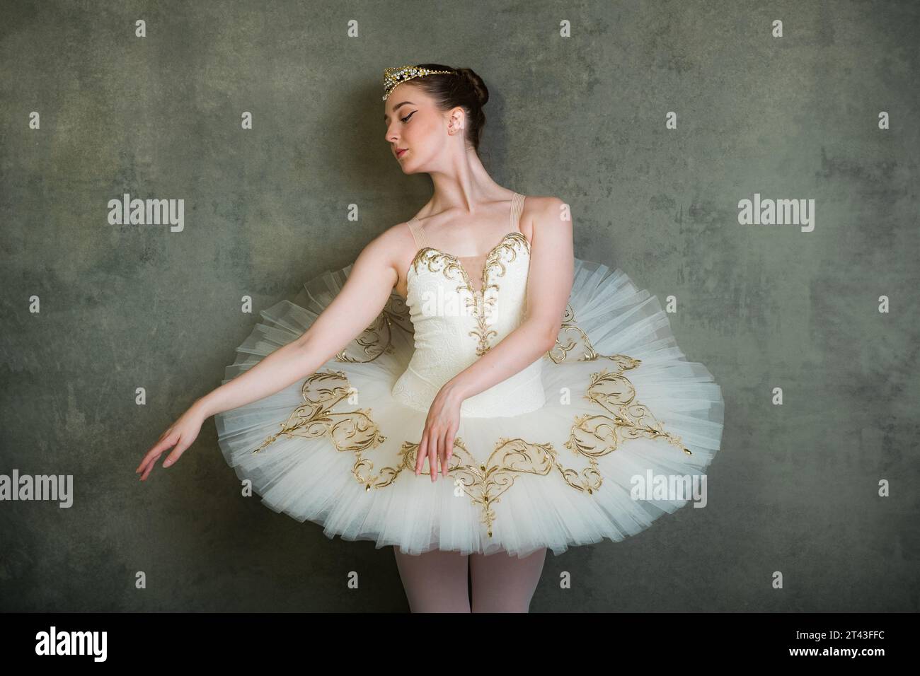 Ballet dancer in white and gold tutu and tiara Stock Photo