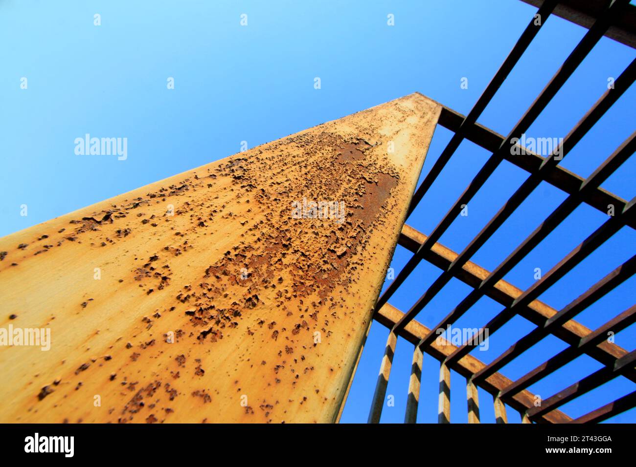 Oxidation rust steel beams in blue sky background, closeup of photo ...