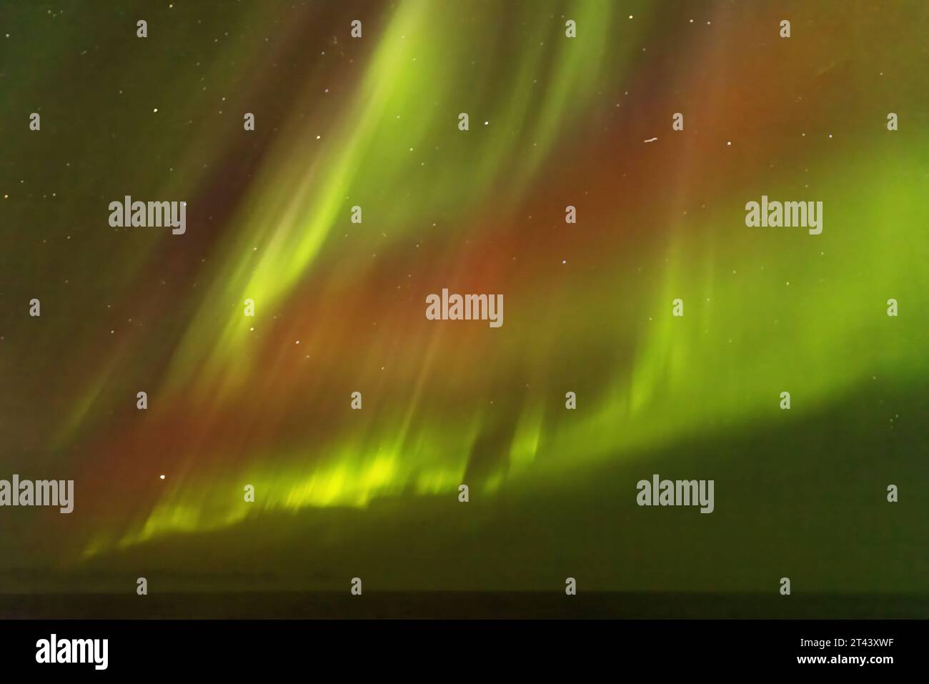 Aurora Borealis or Northern Lights seen at night, -  magnetosphere disturbance due to solar wind; Greenland, Arctic. - Arctic Travel. Stock Photo