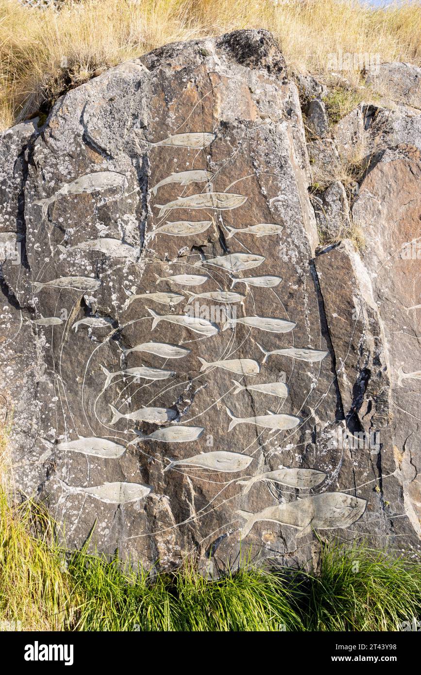 Traditional inuit sculpture; School of Fish; part of the outdoor 'Stone and man' open air gallery of stone sculptures, Qaqortoq, Greenland Arctic Stock Photo