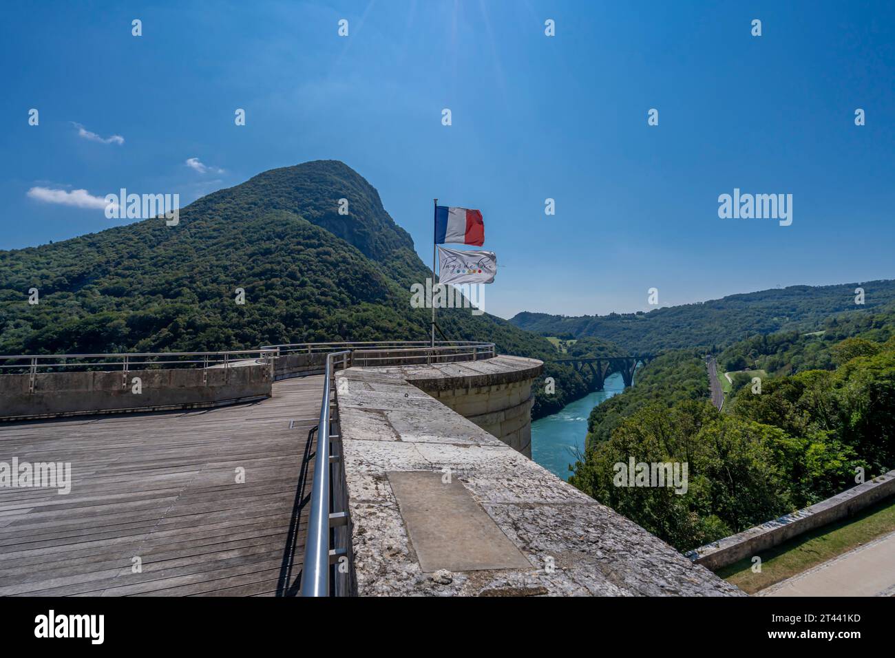 View from the upper fort of French flag and Pays de Gex flag, the Rhone river the Vuache mountain the Longeray Viaduct and a railway track Stock Photo