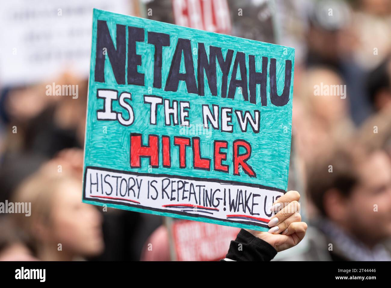 Netanyahu is hitler placard held as Thousands of pro-Palestine protesters gathered for a mass demonstration in Manchester UK. Protesters marched from St Peter's Square in the city centre.Flags and banners were held aloft and flares were let off. Speeches were given at St Peter's Square before and after the circular march. Picture: garyroberts/worldwidefeatures.com Stock Photo
