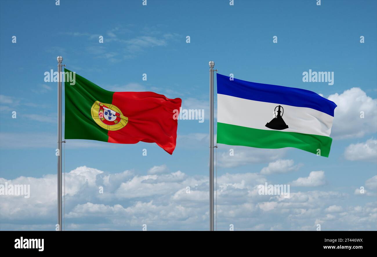 Lesotho and Portugal flags waving together in the wind on blue cloudy ...