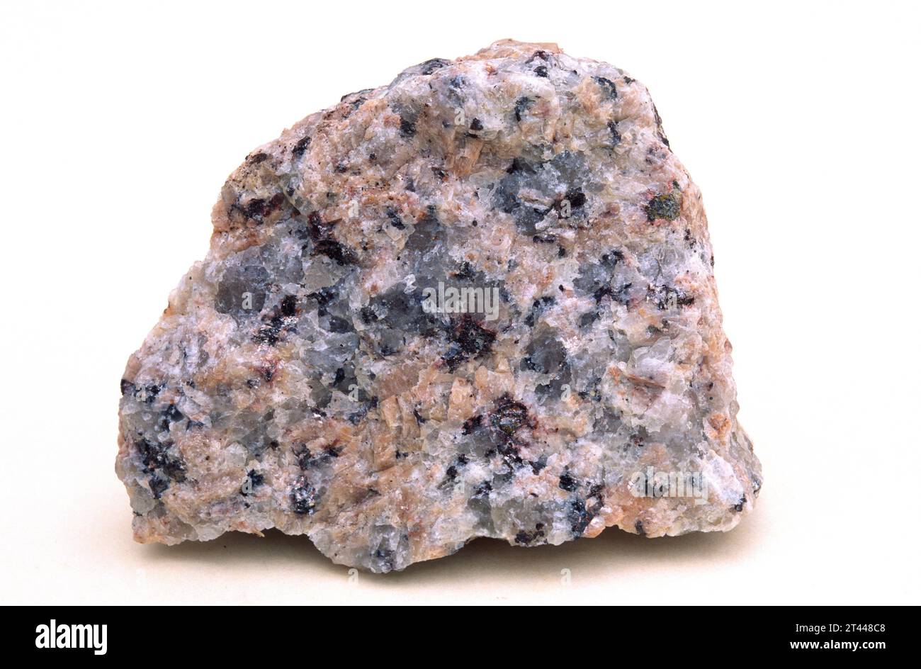 Pink granite. Granite is an igneous intrusive rock with holocrystalline texture. Sample. Stock Photo