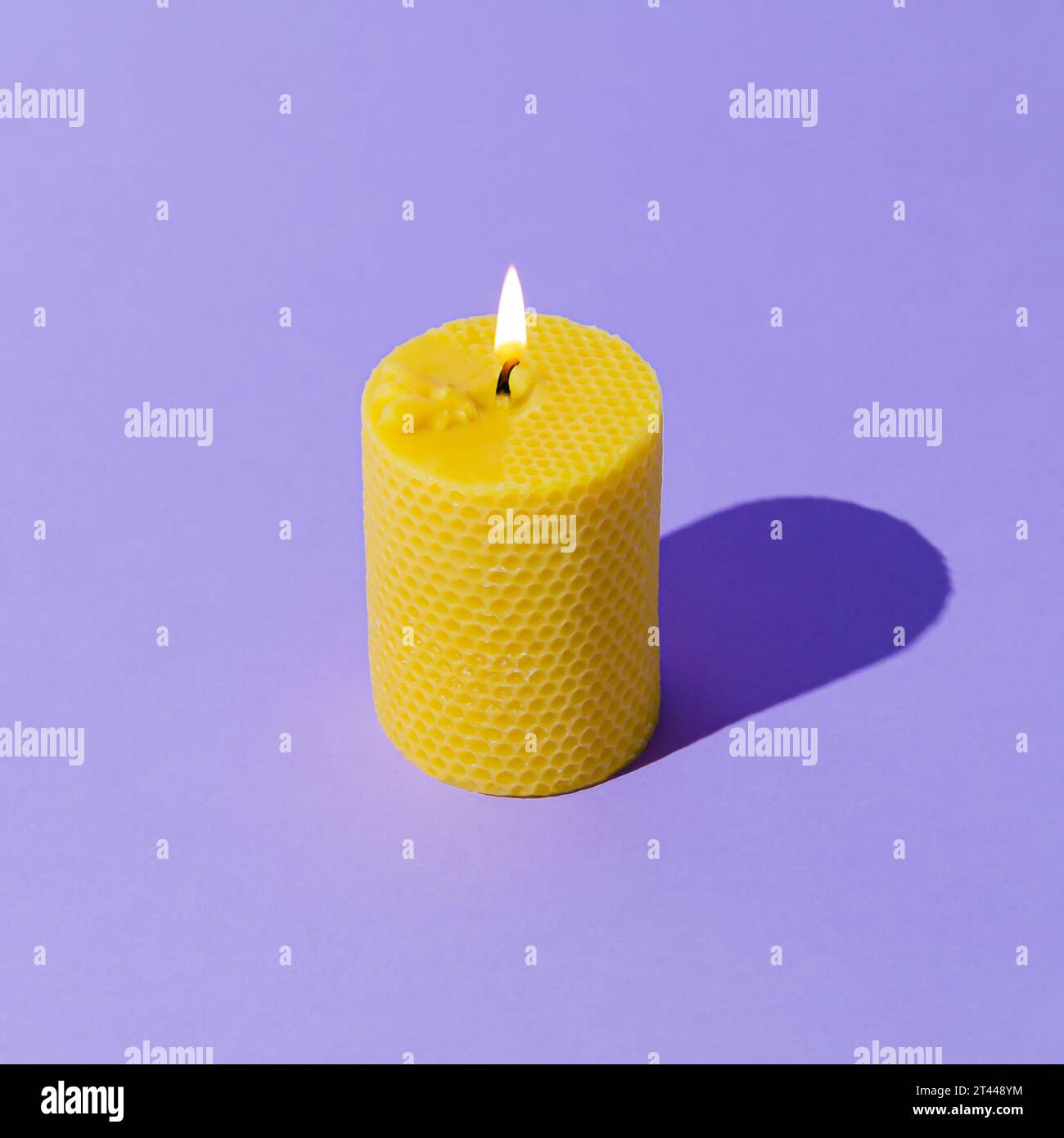 Creative layout of beeswax candle made with natural wax produced by