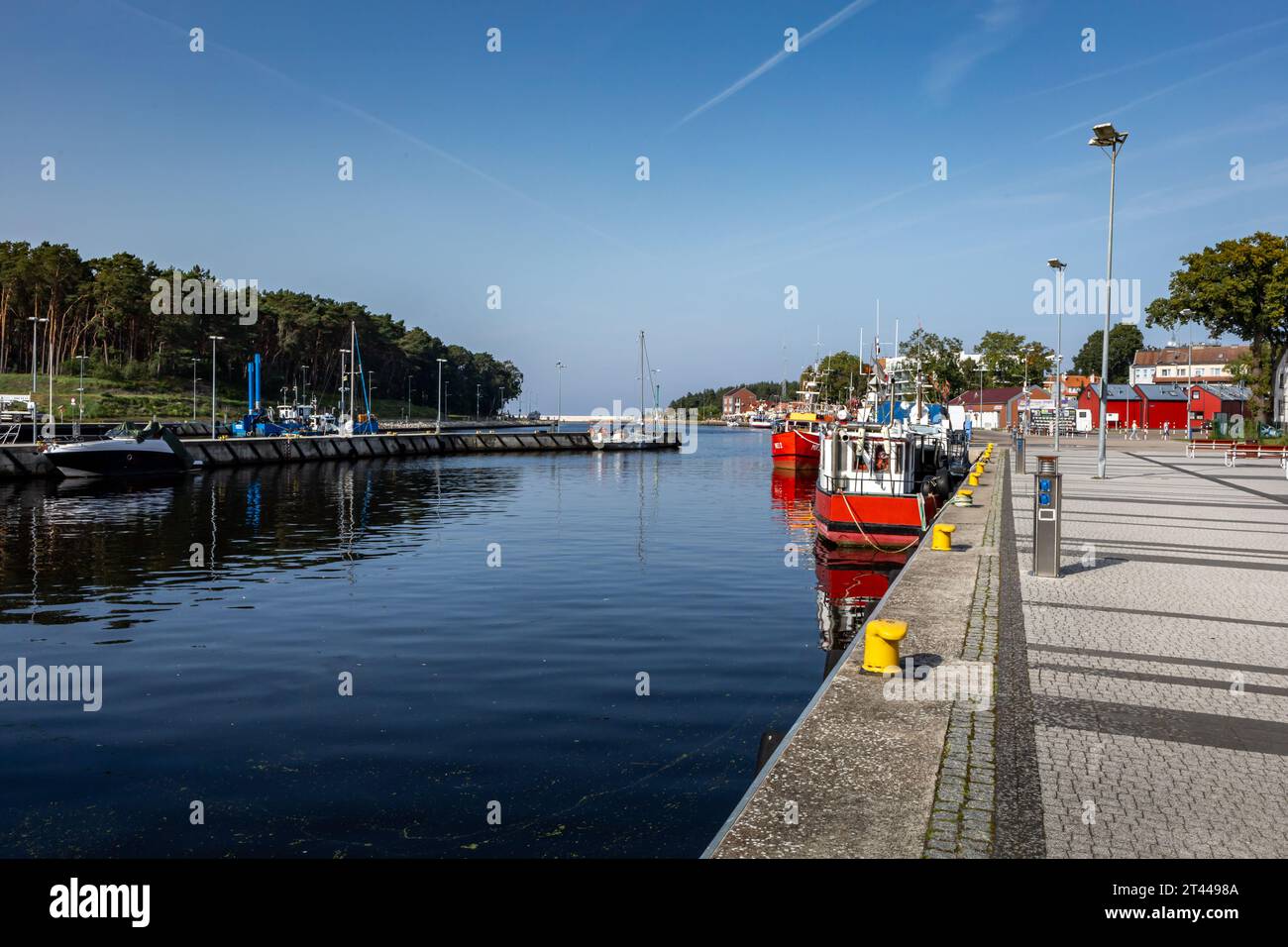 Dzwirzyno, Poland - September 10, 2023: Fishing boats moored in the harbour channel. Stock Photo