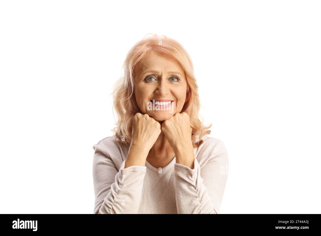 Smiling mature woman with blue eyes and wrinkles on face isolated on white background Stock Photo