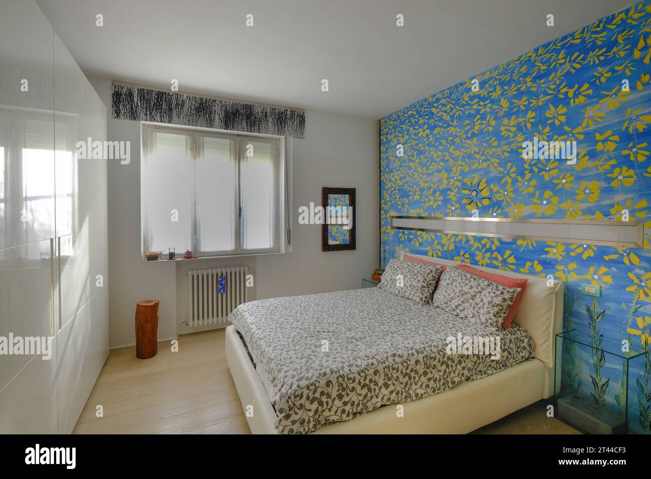 Modern bedroom with wall painted, Italy Stock Photo