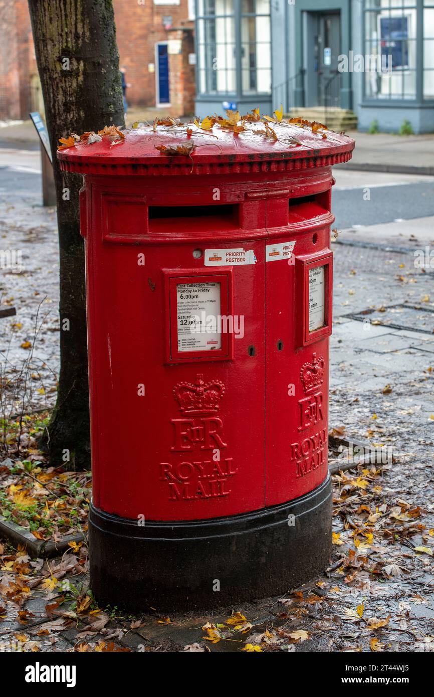 traditional cast iron double gpo royal mail post box or pillar box painted in bright red Stock Photo