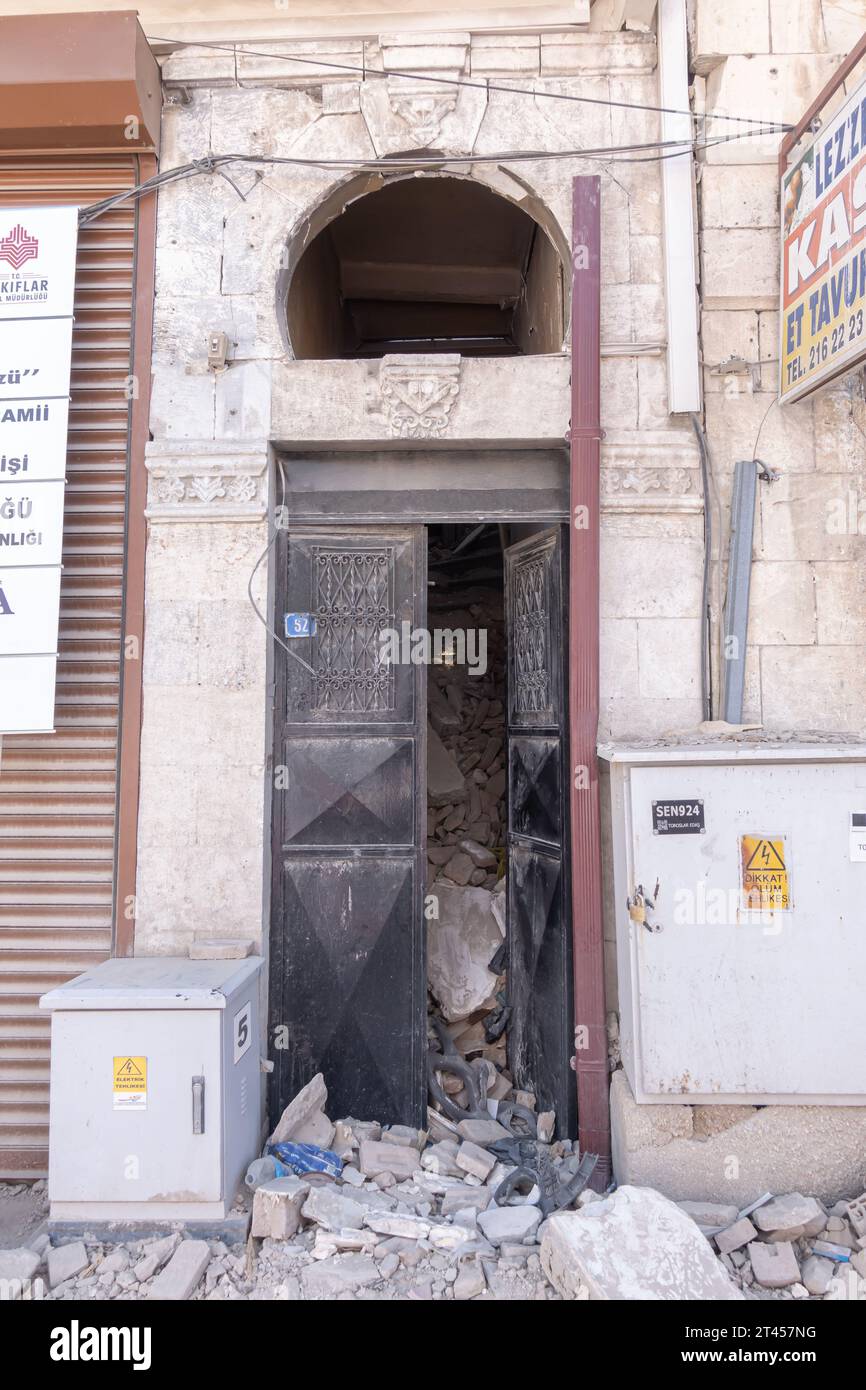 Rubble falling through the door of the historic Ottoman building in