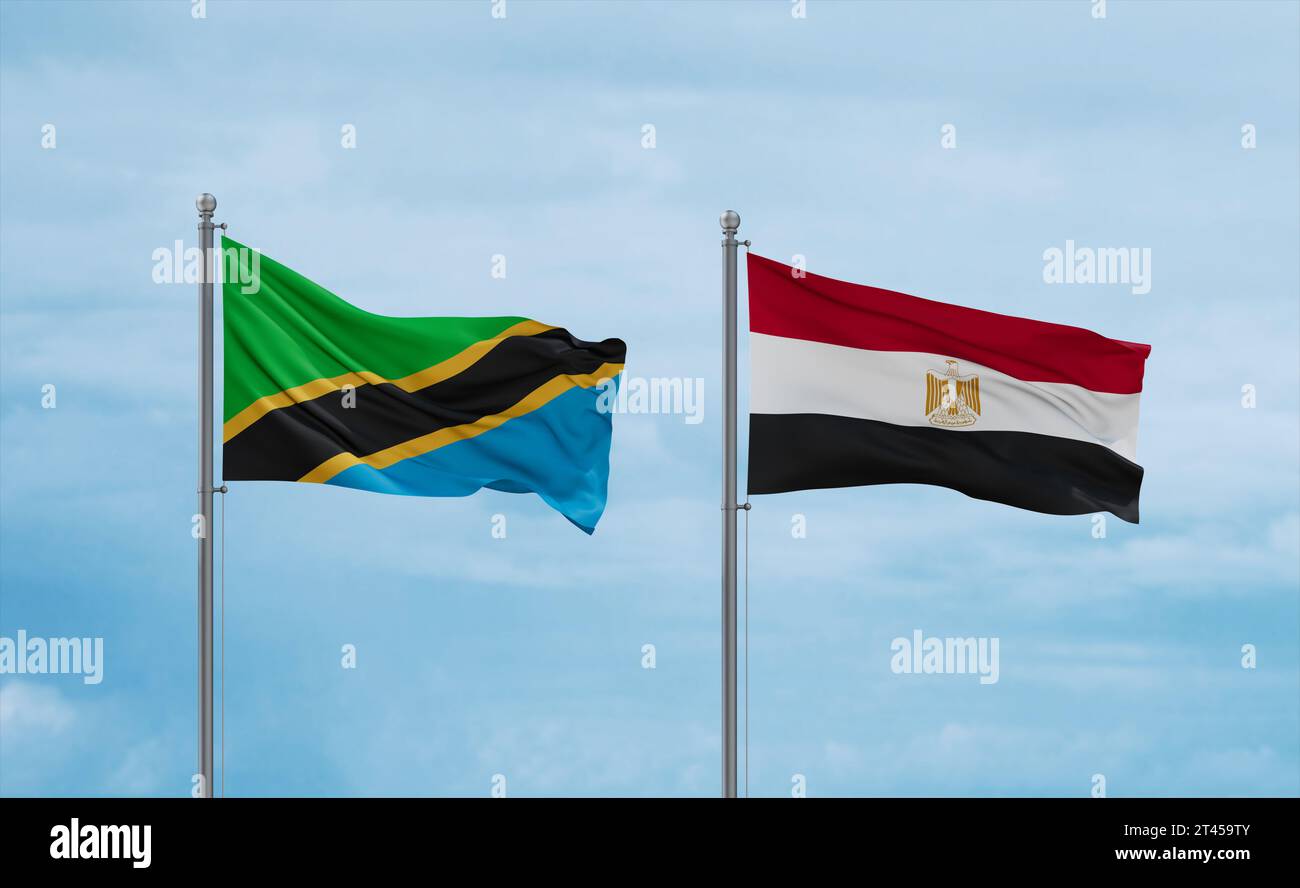 Egypt and Tanzania flags waving together on blue cloudy sky, two ...