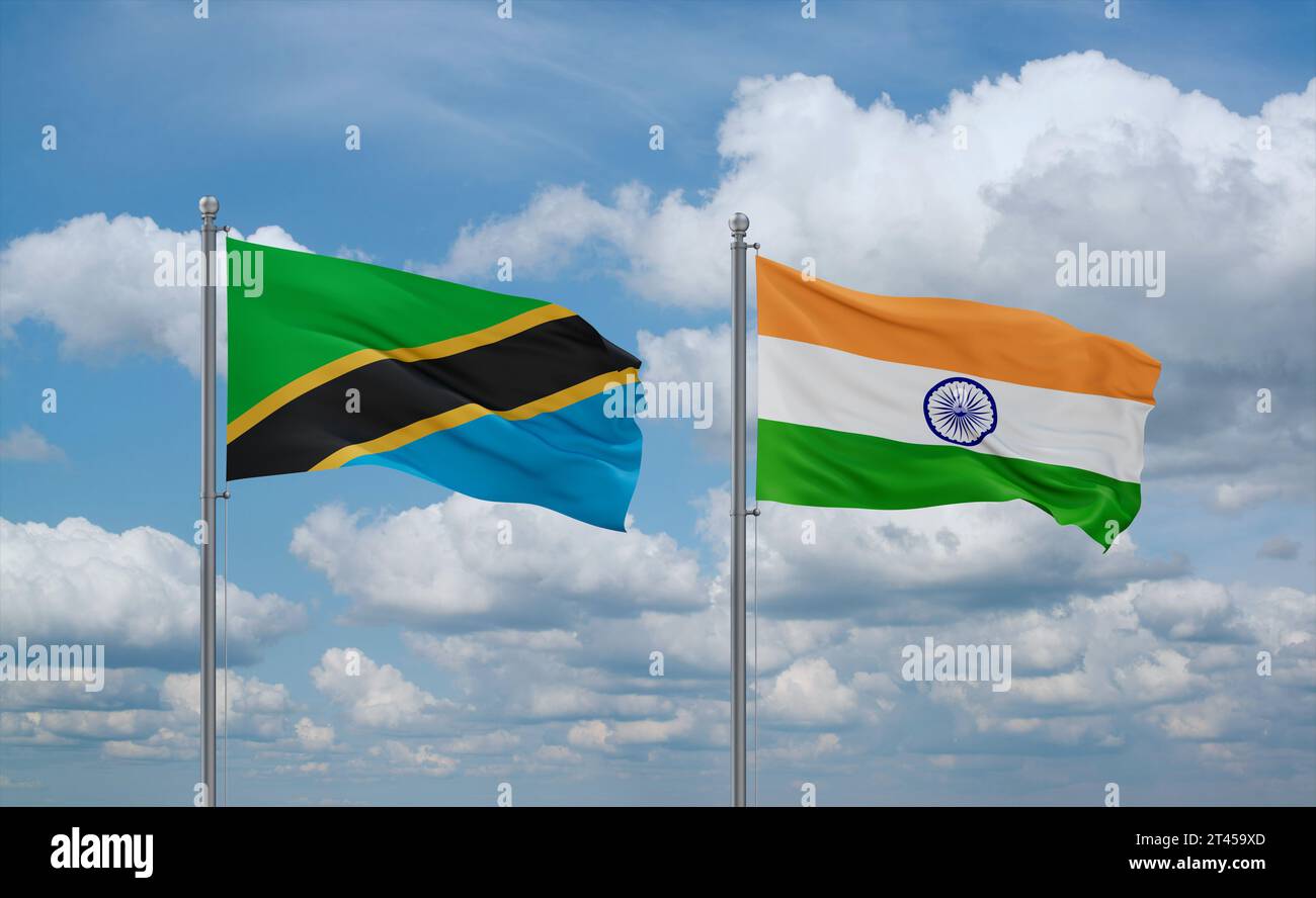 India and Tanzania flags waving together on blue cloudy sky, two ...