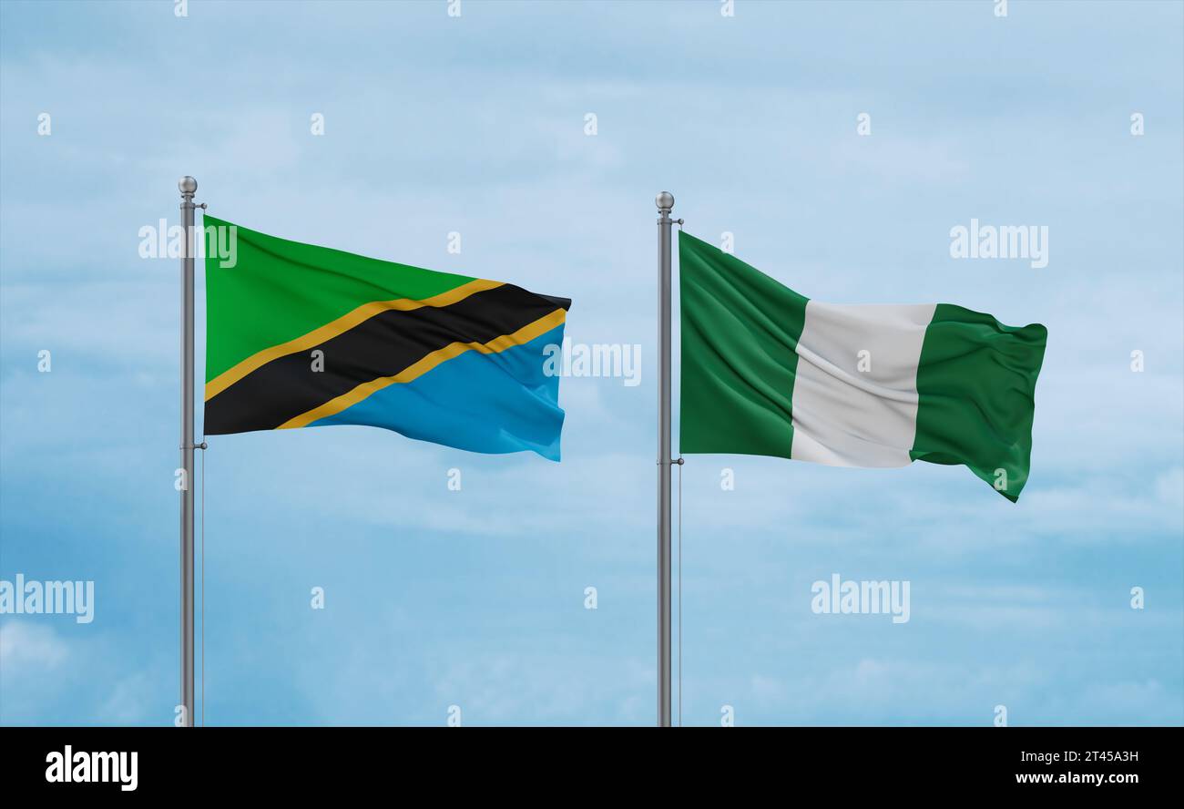 Nigeria and Tanzania flags waving together on blue cloudy sky, two ...