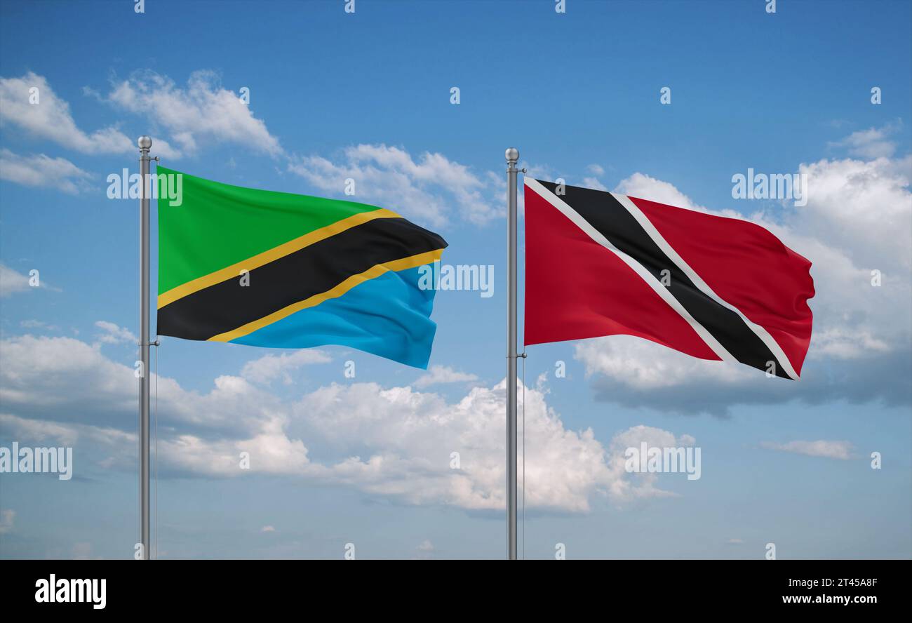 Trinidad and Tobago and Tanzania flags waving together in the wind on ...