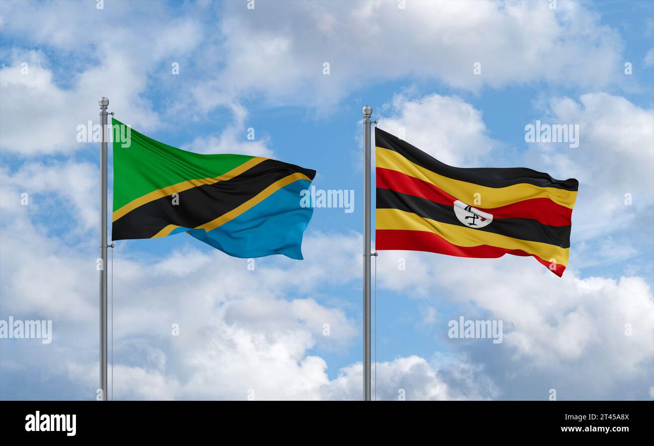 Republic of Uganda and Tanzania flags waving together in the wind on ...