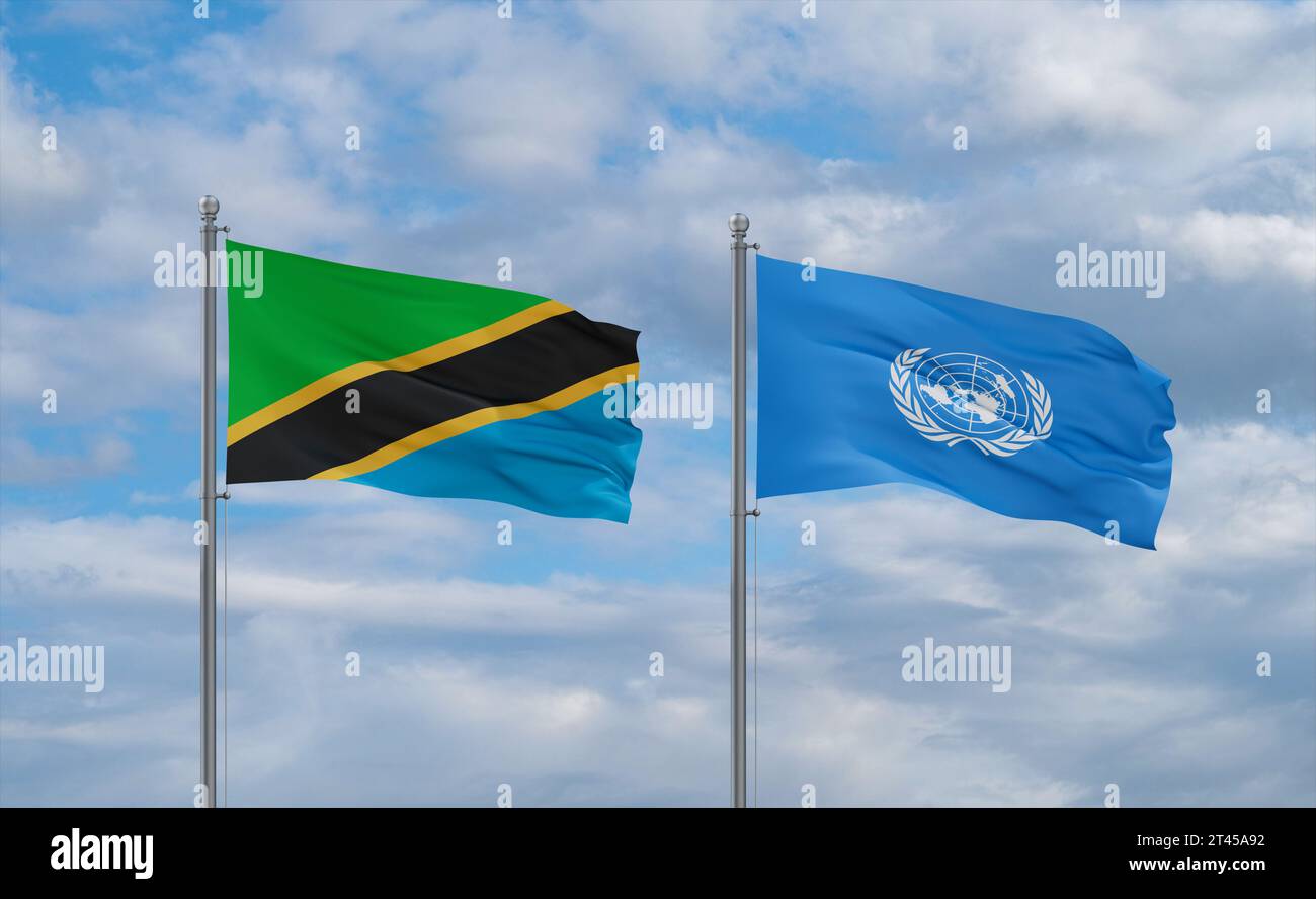 United Nations and Tanzania flags waving together in the wind on blue ...
