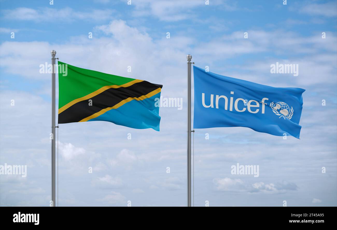 UNICEF and Tanzania flags waving together in the wind on blue cloudy ...