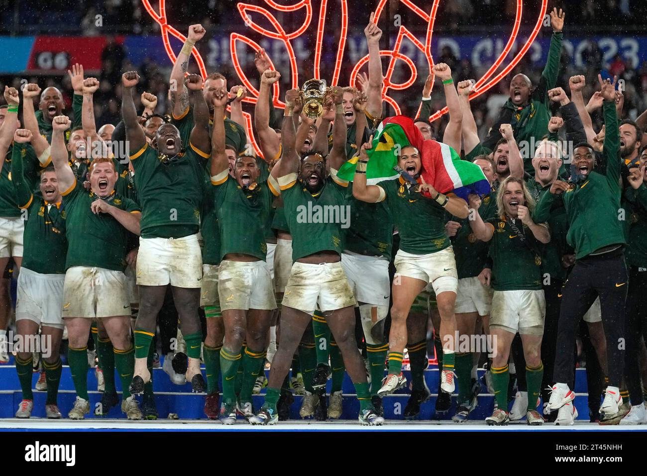 South Africa's Siya Kolisi holds the trophy aloft during presentation ...