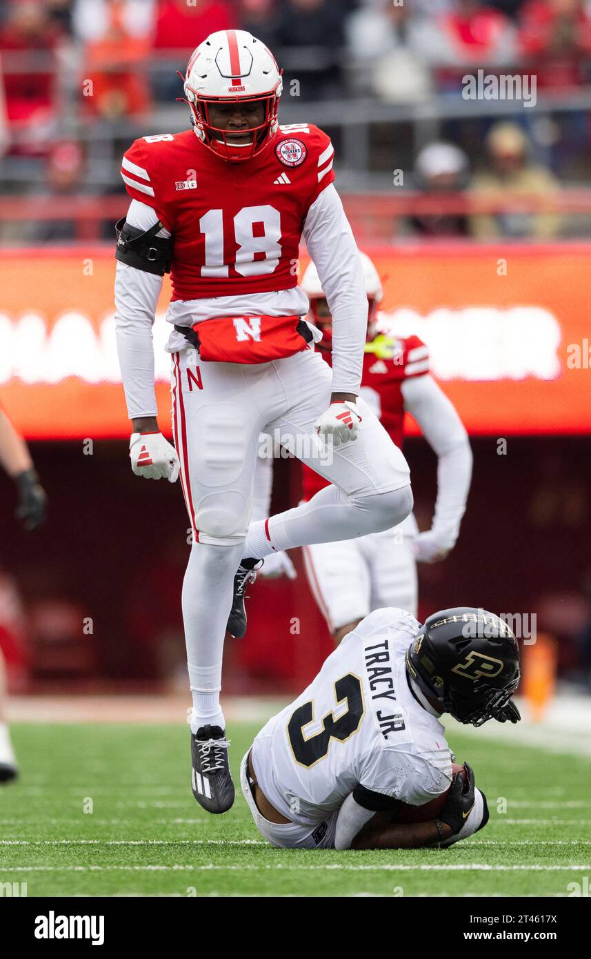 Nebraska's Princewill Umanmielen (18) celebrates after tackling Purdue